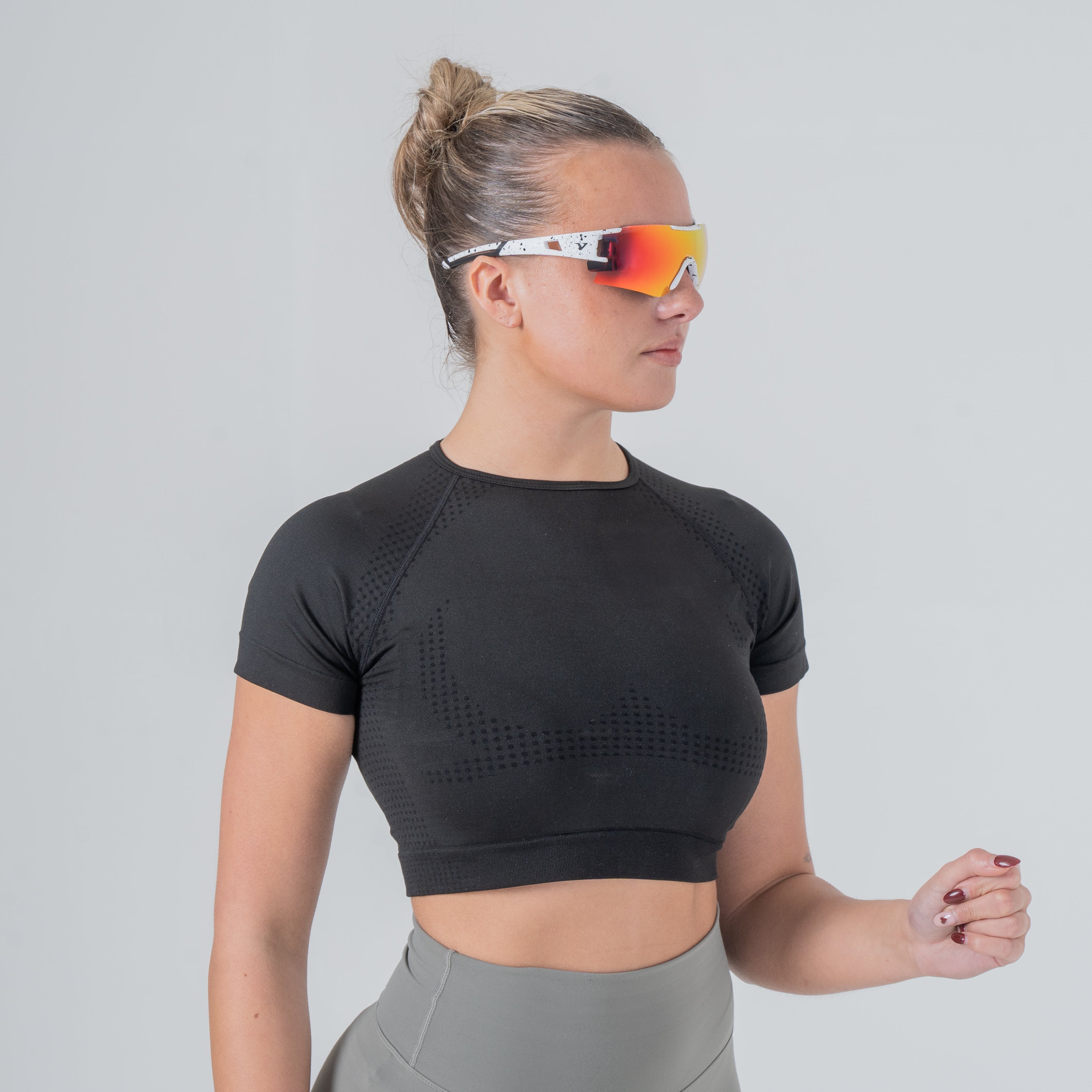 Model in motion wearing Velocity polarized running sunglasses