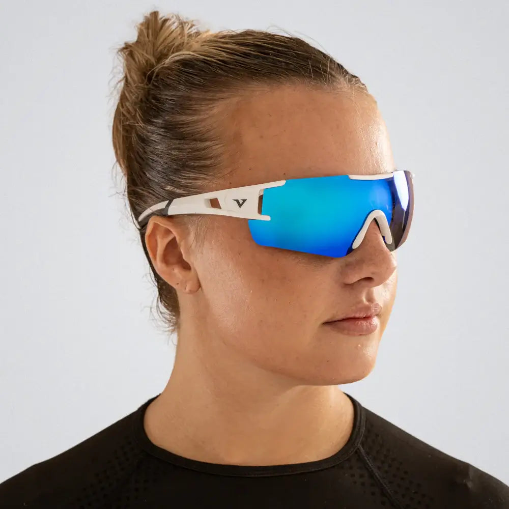 Front-facing photo of runner wearing Velocity Apex shades in bright light